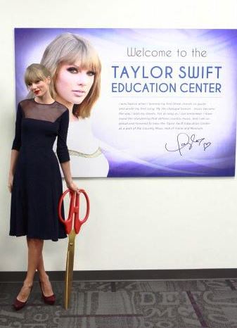 Taylor Swift cutting the ribbon at the Taylor Swift Education Center